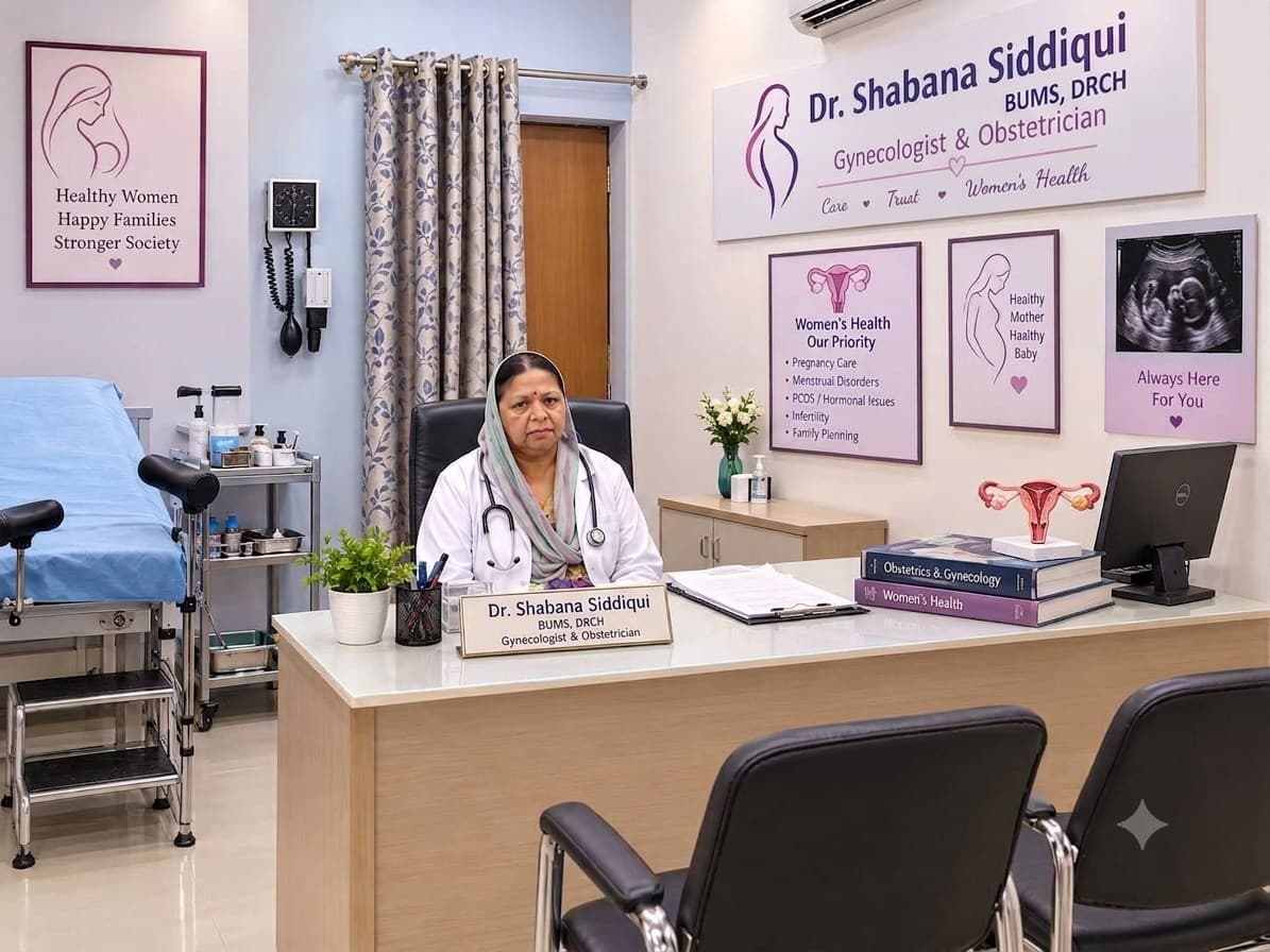 Dr. Shabana seated at her desk in the clinic